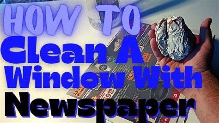 How do you use newspaper to clean windows?